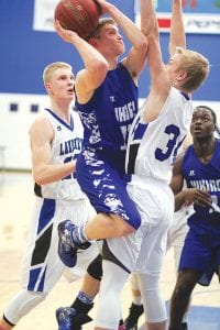 Above: Rory Bakke was fouled on this play but still made the two-point bucket against Lakeview Christian. Right: Jerod Spry has emerged as the team’s go to player this year, finding ways to score, finding the open man, playing tough defense and fighting for rebounds.