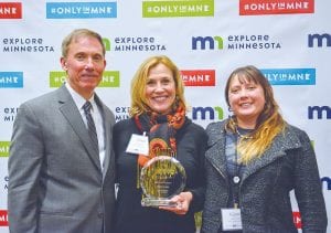 Visit Cook County was once again recognized at the Explore Minnesota Tourism Convention held at Sanford Center in Bemidji on February 3. John Edman of Explore MN Tourism presents the 2016 Travel Marketing Award to Linda Kratt (middle) and Kjersti Vick of Visit Cook County.