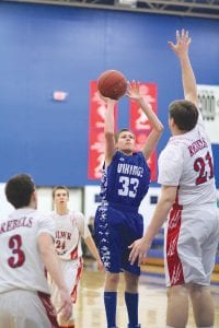 Above: Coming off the bench, Mike Burton gave the Vikings a shot of offense when he hit two straight baskets late in the game against Moose Lake/Willow River. Right: Marcus Logan shows off his nifty ball handling skills in the game against Cromwell, a game in which he scored 11 points.