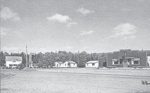 This old postcard shows the cabins that once stood next to the Harbor Light Supper Club. The Harbor Light was originally the Nightengale Café, owned by Marvin Maxwell and Myron Hahn. They leased it to Gordy Sykes and Bradley Picket around 1936 and the name was changed to Harbor Light at that time. Sykes and Picket purchased the property in 1938. The cabins were likely built in the early '30s. The large white house on the far left was the Earl and Myrtle Smith family home (moved from its original location on County Road 48) and rented out by Gordy Sykes. On a 1949 tourist brochure found by Dan Helmerson, there is a listing called the Harbor Light Housekeeping Cabins. The cabins were still standing in the 1970s, but no records can be found of what happened to them after that.