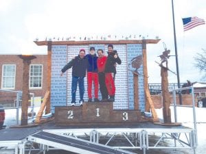 Standing atop the winners’ podium after completing the grueling 55K classic American Birkebeiner cross country ski race were Cook County skiers (L-R) David Eckel, Tim Kennedy, Mike Costello and Fidel Melero-Diaz from Spain. They didn’t really come in first place in the American Birkebeiner cross country ski race, but like everyone who finished this 55K hilly, long distance classic, they were all winners!