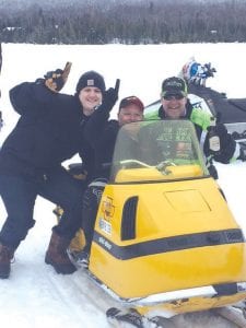 Left: Mike “Rosco” Prehatney, owner of this 1970 Skidoo 399, was one of the vintage sleds on display—and in the race. Rosco is pictured with his “pit crew.” (L-R) Prehatney, Tony Everson and Jimmy Hinriches.