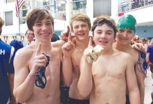 The Cook County Community YMCA 13-14 boys celebrate their 1st place finish at the Minnesota State Championship Meet at the Minnesota Aquatic Center in Minneapolis on Valentine’s Day. (L-R) Will Surbaugh, Henry DeArruda-Weaver, Tanner DeBoer, Ole Sorenson.