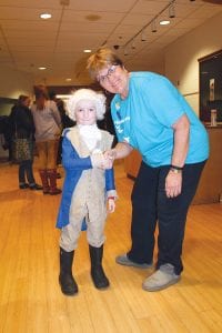 Friendly disagreements were welcome at the DFL caucus at the Arrowhead Center for the Arts in Grand Marais on Tuesday, March 1. Young Bernie Sanders supporter Eero Moody aka George Washington politely shook hands with Hillary Clinton supporter, Sue Hakes.