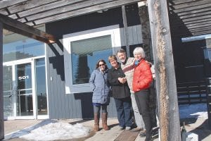 Celebrating a change of ownership and a new beginning were (L-R) North House Program Director Jessa Frost, Sue Hakes, North House Executive Director Greg Wright, North House Board Vice-President Nancy Burns.