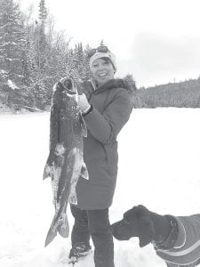 Heather Lynn Waligursky caught this 34-inch, 18-pound lake trout while being guided by Cory Christianson. Heather and her husband were honeymooning at Gunflint Lodge.