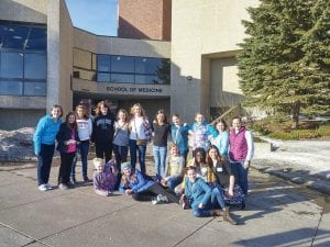 On Sunday, March 6, a group of Cook County Middle School students and teachers traveled to the University of Minnesota-Duluth School of Medicine to take part in “Women in Science.” The girls got to meet and ask questions of more than a dozen women in various scientific fields, ranging from limnology and marine biology to neuroscience and chemistry and more. Attending were (L-R, seated) Izabella Sparks, Emma Gesch, Hazel Oberholtzer, Zoe Nonnemacher, Molly LaVigne (front) and a friend from Duluth. (L-R, back) Science Teacher Morgan Baldwin, RaeAnne Silence, Christianna Ashleigh Precord, Abby Stoddard, Jaymie Kirk, Louise Ramberg, Malin Anderson, Ella Sporn, Amy Carpenter, advisor Emma Spoon.