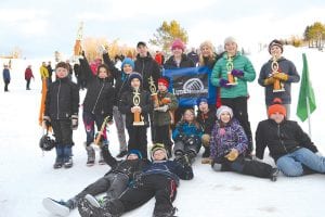 Celebrating after a great day on the slopes at Mont Du Lac were some members of the Lutsen Junior Alpine Ski Team. (L-R, lying in front) Graham Oberholtzer, Cy Oberholtzer. (L-R, middle) Georgi Dimitrov, Elliot Zimmer, Sol Nies (lying), Tristan Surbaugh, Lexi Surbaugh, Cayden Zimmer. (L-R, back) Noah Haussner, Alessandra Duclos, Kalina Dimitrova, Will Surbaugh, Bianca Zimmer, Hazel Oberholtzer, Ella Sporn, Ray Dressely.