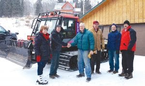 Some members of Norpine Trail Association thanking Maureen and Michael O’Phelan of Cascade Lodge for the donation of the Pisten Bully. (L-R) Maureen and Michael O’Phelan, Bob Pranis, Pete Harris, Jerry Lilja, Mark Delamater. The Pisten Bully is essential for grooming trails in very deep snow and in restoring trails that have become crusty and iced over.