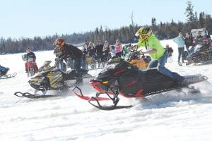 One last snowmobile drag race was held on Poplar Lake at Windigo Resort on Saturday, March 12. The weather was warm enough that some racers wore only T-shirts!