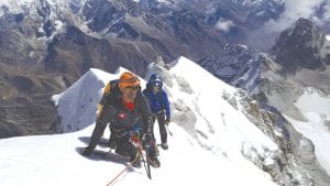 Lonnie Dupre (in front) works his way up a mountain in Nepal. Dupre is planning a climbing expedition in Alaska in late April in which he and four other climbers hope to summit Mount Begguya, which is considered the hardest 14,000 foot climb in North America. He will use that endeavor as a training ground for further climbs planned next fall in Nepal. Photo courtesy of Lonnie Dupre