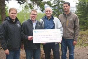 Last fall Schroeder Supervisor Bruce Martinson received a $2,500 check from Minnesota Power/ALLETE officials that will help pay for the cost of the public viewfinders that will soon be installed at the Taconite Safe Harbor. (L-R) Minnesota Power employees John Paulson, Al Rudeck, Martinson, Matt Radzak of Minnesota Power.