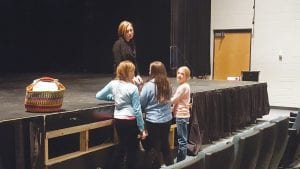 This cluster of fourth grade students was excited to talk to the visiting author after the presentation.