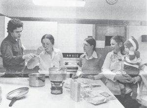 The annual “Food Day” was held May 1 and 2, 1981, sponsored by the Whole Foods Co-op and the Women’s Club. One of the workshops offered was “Trail Foods,” presented by Bill Hansen. Here he explains what all the ingredients are in gamush, a dried dinner he prepared for his talk. Shown from left are Hansen, Christy Buetow, Arvis Thompson, and Kaye and Mitchell Tavernier. Gamush, by the way, is a mixture of lentils, brown rice, vegetables and spices.