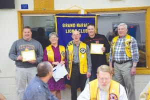 At the April 26 meeting of the Grand Marais Lions Club, the organization happily welcomed new members (L-R) Mike Ryden, sponsor Lion Millie Spry, Lions Club President Bob Spry, Adam Nelson, sponsor Darold Rosbacka.