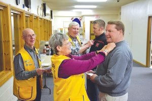 After being welcomed with a traditional Lions Club roar, the new Lions Club members received a special Lions Club pin.