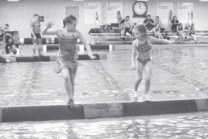 Above: Kamryn Johnson (left) rolls against a smaller competitor at the Rusty Ankle log rolling tournament. Log rolling is based on quick feet, good balance, endurance, and technique, so size rarely matters in competitions. Left: Ali Duclos (left) finished second in the girls’ U-10 division at the Rusty Ankle tournament.