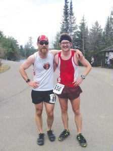 Jay Arrowsmith DeCoux (left) and Jesse Baldwin battled for the win in the Cook County YMCA Ham Run Half Marathon with Arrowsmith DeCoux narrowly taking the win over his friend in the 13.1-mile race.