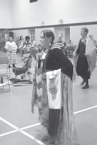 Above: Jaye Clearwater of Grand Portage dances the circle in her intricate regalia. Left: This man’s regalia includes elements with deep personal meaning. Many items such as eagle feathers and animal hides are handed down through generations and are considered sacred.