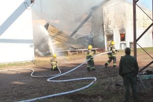 The Maple Hill and Grand Marais fire departments responded to a fire at Hedstrom Lumber on Sunday, May 8. The fire destroyed the former planing mill building, but the fire departments were able to stop the blaze from spreading to the adjacent building.