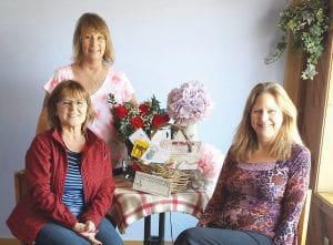 The winner of the Mother’s Day Pampering Package is Lori Hommerding of Grand Marais, who was nominated by her daughter, Rheanna. Organizers were delighted to present her with the package. (L-R) Lori Hommerding, Lisa Larsen of Northern HiLites (behind), Laura Dalin, Essential Touch Massage.