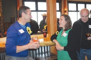 In addition to the serious subject of Cook County’s economy, there were lots of smiles as friends discussed the things they love about our community. Above: Grand Marais Art Colony Director Amy Demmer welcomed everyone.