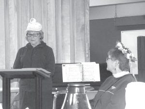 The Bethlehem Lutheran Church women gathered for their annual spring luncheon on Saturday, May 14, 2016. The invitation to the event asked attendees to come dressed as they would to enjoy their favorite summer activity. An important part of the event is the selection of an “Angel of the Year.” This year’s honoree is Jeanne Sandbo. Left: She was introduced by Shirley Soderholm and crowned by Jody Daugherty. Millie Gestel presented her gift, a traditional angel.