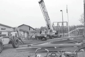 For the next year and a half the hospital/care center will be the site of a lot of equipment like this huge crane as a large team of construction workers pitch in to complete the $24.5 million expansion and remodel of the facilities.