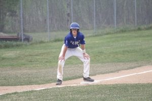 Mr. Trouble, Owen Anderson, a noted base thief, stands on third base just waiting for the pitcher to make a mistake.