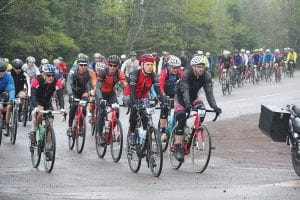 Above: The real work began for the Le Grand du Nord racers when they came off the tar of Highway 61 and pedaled up the gravel Lindskog Road. Right: In the 50-mile race Will Surbaugh finished 11th. Middle right: John Alt placed 7th. Far right: Tim Lederle finished 14th.