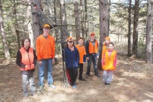 In addition to learning the fundamentals of shooting and hunting ethics, students must demonstrate that they know how to safely carry a firearm through the woods and that they know the basics of tree stand safety. This class passed the 50-question written test and completed the field day activities to earn their hunter safety certification.