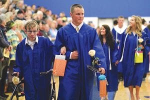 The Cook County High School gym was crowded with friends and family on Saturday, June 4, 2016 for the commencement exercises for the Class of 2016. Among the happy graduates leaving the gym after receiving their diplomas were Sam Kern (left) and Frankie Miller.