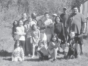 Above: Students from Grand Portage’s summer camp placing a scarecrow they made for the Elders’ garden area. Camp Counselor Richard Vondall and Amy Schmidt, of SNAP food program, helped erect it. Left: Local Elders Ted and Elsie Smith celebrated their 70th wedding anniversary with friends and family. They enjoyed a beautiful cake provided by their daughter, Lori. When they married, they did not have a cake—in fact Elsie said she cooked the meal for their guests after the ceremony!