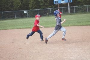 Youth baseball has begun! Parent Pitch games got under way on Tuesday, June 7. The Lions and the Lumberjacks faced off at the Grand Marais Recreation Park field. Lumberjack Devan Rude chases down Lion Jake Mixdorf for an out.