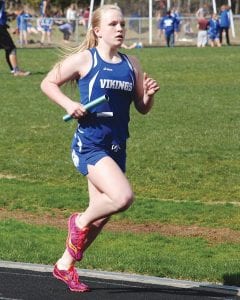 Sophie Eliasen carries the baton for the Vikings in a recent track meet. Eliasen finished in 6th place at the section 7A track meet.