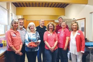 It seems that Ruby’s Pantry volunteers have a good time, whether distributing food or preparing and serving food! Some of the kitchen crew at the May 24 anniversary celebration were (L-R) Jane Shinners, Bob Padzieski, Ginny Padzieski, Dan Riddle, Melodee Riddle, Barb Spaulding, Larry Spaulding, Georgene Daubanton.