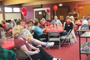 Above: Many of the people who volunteered with Ruby’s Pantry gathered to enjoy the dinner and a brief presentation. Left: Introduced at the dinner was a new initiative, Recycling for Ruby’s. This new offering will benefit the environment and Ruby’s Pantry.