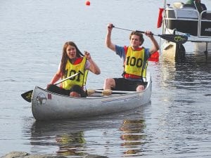 Participants in the 2015 Gunflint Canoe Races, Liz Smalley and Dan Ahrendt, representing Tuscarora Lodge, celebrated at the finish of their race.