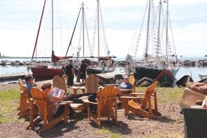 North House Folk School held its 19th annual Wooden Boat Show on June 17-19 and the waterfront campus was filled with boating enthusiasts, fans of traditional crafts and folks who just wanted to enjoy the day with friends. This group has a wonderful view of the North House Folk School schooner Hjordis, which was joined for the weekend by the Zeeto, a three-masted, gaff-rigged schooner, on the right. See more Wooden Boat Show and Summer Solstice Festival photos on page B3.