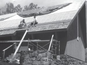 The historic Trinity Lutheran Church in Hovland is getting a new roof. Smith Construction is hard at work adding insulation and laying cedar shakes.