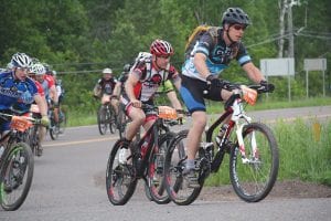 Pedaling hard, Tom Wahlstrom leads this pack of determined riders. Despite racing 100 miles the week before at the Chequamegon Fat Tire Festival races, Wahlstrom still managed to finish 17th overall in the 69er race.