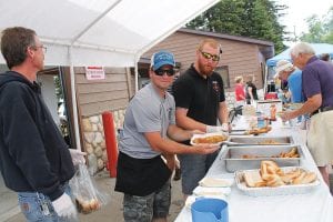 Left: Once again there was a long, long, line at the Lutsen Fire Department’s fish fry tent.