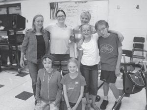 The “Ancestors” from The Addams Family with choreographer Christine Curtis. Grand Marais Playhouse Director Sue Hennessy wanted to show them now, as you may not recognize them in the performance. (L-R, front) Hattie Meyer, Bryn Fitzgerald-Wells. (L-R, back) Amy Henrikson, Christine Curtis, Susan Bragstad, Greta Roth, Sam Kern. Not Pictured: Tina Krauz.