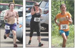 Far left: Joey Chmelik (275), Grand Marais, sprinted to a second place finish. Middle left: Ellie Anderson (329) of Golden Valley, Minnesota, finished with a time of 1:19:53.1. Left: Louise Ramberg (343) Grand Marais, placed 8th in the women’s field. Above: A little mud couldn’t diminish the joy of Joe and Amberley Futterer of Fayetteville, Arkansas as they finished the 10K holding hands.