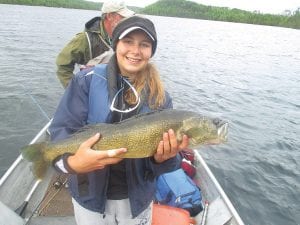 Nellina Wooten, 16, of Obion County, Tennessee was fishing with her family on Flour Lake when she caught this trophy 30-inch walleye, which was released. She caught it on a night crawler around 8 p.m. on June 15 in 15-20 feet of water, jigging under the boat.