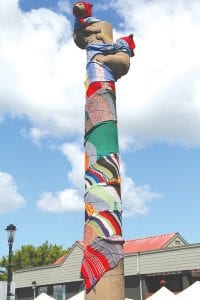 Left: Yarn bombers went to great heights to decorate the bear cubs at Bear Tree Park for the festival. Above: Kids of all ages enjoyed watching the spinning and sculpting of the Northern Clay Center Claymobile.