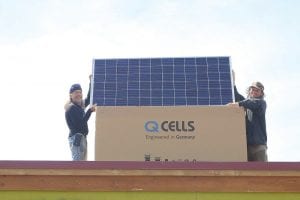 Brian Bennett (left) and Shem Falter recently installed 72 photovoltaic solar panels on the roof of the Cook County Whole Foods Co-op building. The solar panels will generate 31,000-kilowatt hours of electricity per year, enough to reduce the co-op's electrical bill by about $3,000 per year. As a leader in environmentally sustainable practices, installation of solar panels allows the co-op to cut its energy consumption, operating costs, and reduce its carbon footprint.