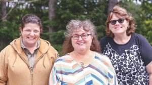 Some of the busy people recognized for inspiring others to get moving. Top: Amber Pfeil nominated two people who inspire the community by walking every day. (L-R) Pfeil and walkers Valita Bockovich and Carrie Newman. Above: Amanda Anderson, a 2015 Move It! award winner, paid it forward by giving credit to her son who helps keep her moving. Left: Nina Woerheide nominated her bike enthusiast cousin Adrian Hess.