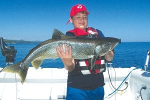 Jeramiah Fox of Breckenridge, Minnesota landed a massive 15-pound, 36-inch lake trout while fishing with Captain Darren Peck of Tofte Charters.