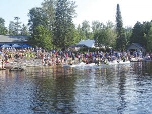 The Gunflint Trail Canoe Races held on the Gunflint Lodge waterfront on Wednesday, July 20 were once again a huge success. The weather was so hot that paddlers that ended up in the water didn’t mind at all! Above: New this year was the first annual Tug-of-Waron Canoes between U.S. Forest Service and Gunflint Trail Volunteer Fire Department personnel. The winner of the event dubbed “Paddle Hard—Go Nowhere” was the Gunflint Fire Department team of Quinn McCloughan and Bill Middlesworth. Left: One of the most popular events to watch—and most challenging for participants—is the Gunnel Pumping race.